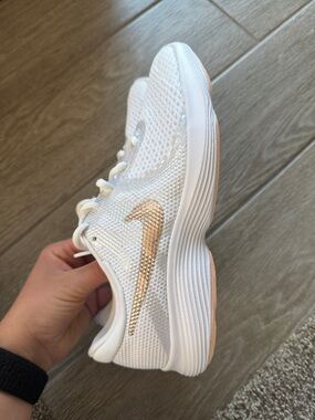 Nike Women’s White Running Sneaker with Rose Gold Swoosh